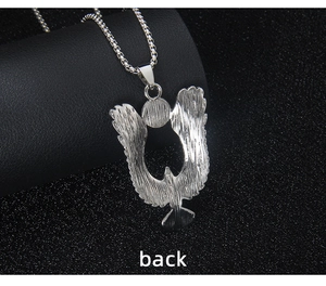 Macro shot of the back of the flying eagle pendant showing brushed metal texture