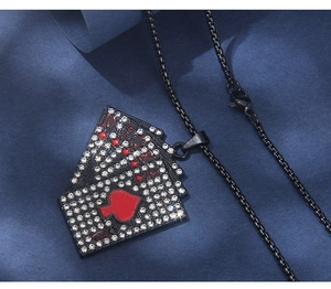 Detail of black stainless steel poker royal flush pendant with sparkling zircons and red oil