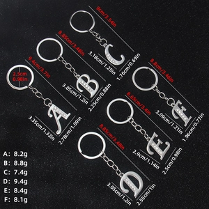 Silver metal alphabet keychains A to F with sparkling rhinestones and measurements
