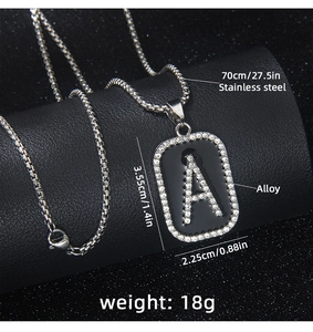 Detail of hip hop rectangle A letter pendant with black oil drip and inlaid rhinestones