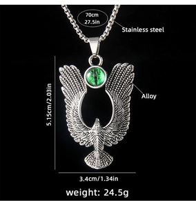 Detail of eagle pendant with green dragon eye stone and size specs on black background