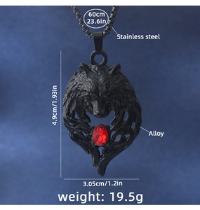 Detail view of black wolf head pendant with red gemstone inlay and stainless steel chain