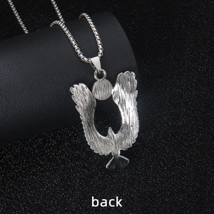 Detailed back view of silver stainless steel eagle pendant with lifelike feather texture