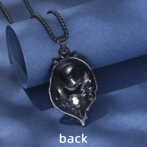 Back view of black wolf head necklace with intricate hollow structure and white crystal