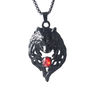 Black stainless steel wolf head necklace with a vibrant red rhinestone and bead chain
