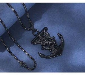 Detailed close-up of a black stainless steel anchor and eagle pendant on a square pearl chain