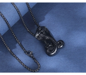 Detail of black mamba snake pendant necklace showing realistic scales and gothic textures