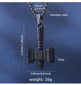 Macro detail of Mjölnir pendant with Nordic knots and black stainless steel chain