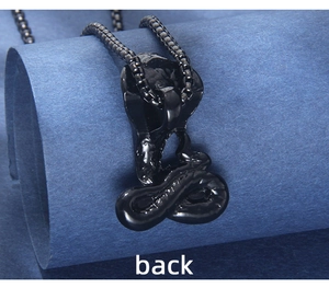Detailed back view of a black cobra snake pendant in polished stainless steel finish