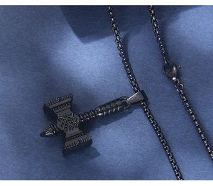 Close-up of black matte Thor's Hammer pendant with Nordic Celtic knots on box chain