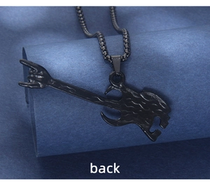 Detailed back view of the black rock style guitar skull pendant with rock gesture