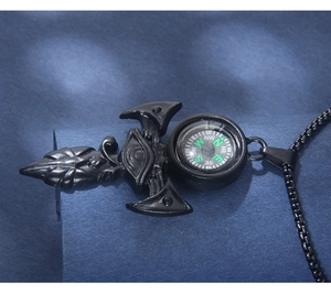 Detail view of black stainless steel sword pendant with Eye of Horus and small compass