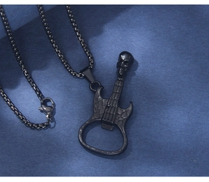 Detail of gothic guitar pendant with skull design and integrated bottle opener function