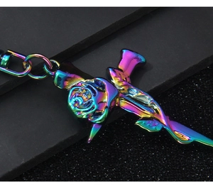 Macro detail of metallic rose keychain with vibrant rainbow electroplated finish