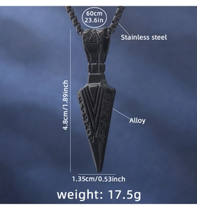 Detail view of black stainless steel arrow pendant with vintage Nordic runes and box chain