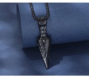 Close-up of black stainless steel Viking arrow pendant with Valknut and rune symbols