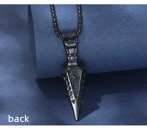 Macro back view of black stainless steel Viking Valknut pendant and engraved runes