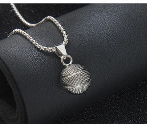 Detailed macro view of 3D solid basketball pendant with realistic textured surface finish