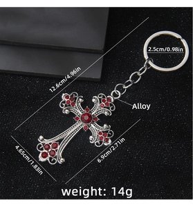 Detail showing dimensions of vintage silver cross keychain with red rhinestones