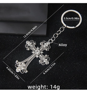 Detail view of crystal cross keychain showing dimensions and silver alloy texture