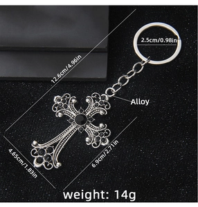 Detailed view of Gothic vintage cross keychain with black crystals and alloy carvings