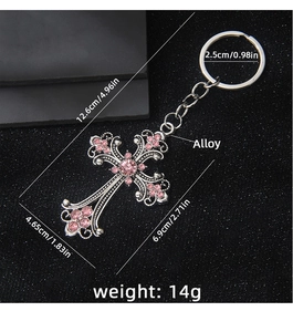 Detailed view of silver cross keychain with pink rhinestones and size specifications