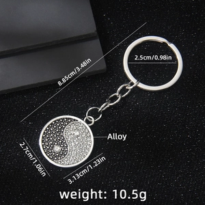 Black and white Yin Yang Tai Chi keychain with sparkling crystals and silver metal chain