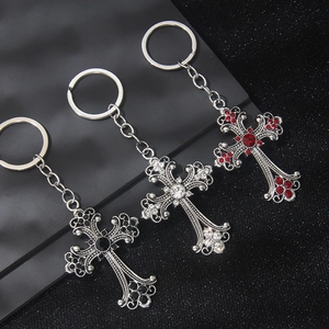 Gothic style silver cross keychains with red, white, and black rhinestones for bags
