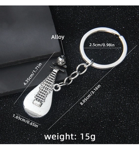 Detail view of silver alloy pipa musical instrument keychain with dimension markings