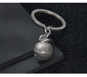Macro detail of silver basketball keychain showing realistic textured ball and metal ring