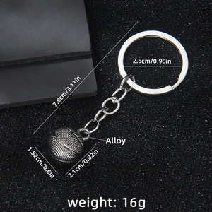 Vintage solid basketball keychain with alloy chain on black textured background
