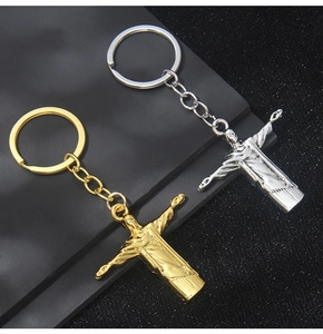 Detail view of Christ the Redeemer metal keychains in gold and silver finish