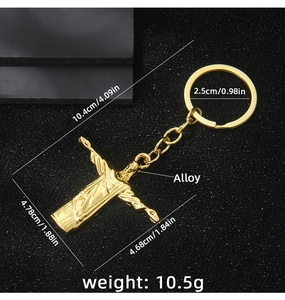 Golden alloy Christ the Redeemer keychain with dimensions 10.4cm length and 2.5cm ring