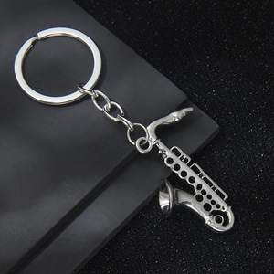 Vintage silver saxophone musical instrument keychain with polished alloy metal finish