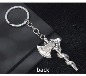 Detailed back view of vintage silver Viking battle axe keychain with intricate metal textures