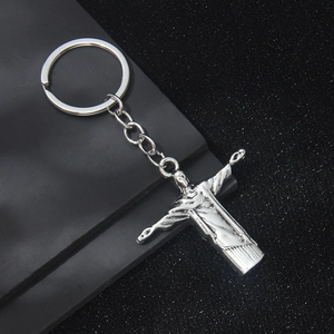 Vintage silver metal Jesus Christ statue keychain featuring the Rio Redeemer icon