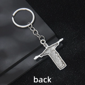 Silver metal Christ the Redeemer keychain showing back side texture and sturdy ring