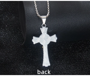 Detailed back view of a gothic cross pendant with textured geometric engraving and box chain