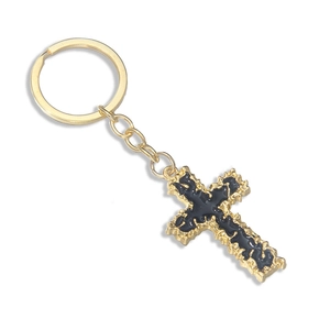 Gothic gold cross keychain with black enamel detail on white background for bag charm