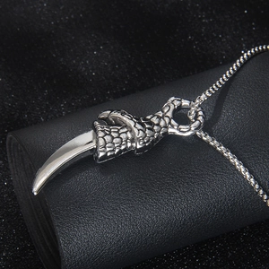 Dominant dragon claw pendant necklace in stainless steel with detailed scale texture