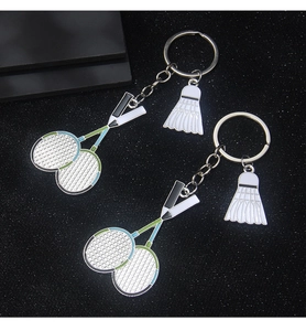 Detailed close-up of alloy badminton racket and shuttlecock keychain with drip oil finish