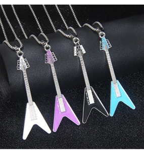 Detail view of four guitar necklaces in white, purple, black, and blue enamel finish