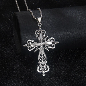 Vintage silver hollow cross pendant necklace with engraved scroll pattern on box chain