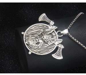 Detail of Viking warrior pendant with double axes and wings on a stainless square chain