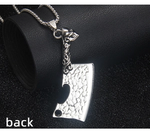 Detailed back view of punk skull cleaver pendant with hammered steel texture