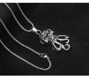 Detail of gothic stainless steel octopus skull pendant with a durable square box chain