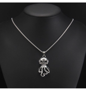 Gothic octopus skull pendant on a black bust showing detailed stainless steel box chain