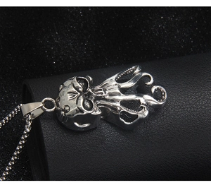 Detailed close-up of gothic octopus skull pendant in vintage silver stainless steel