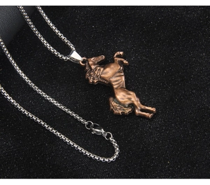 Detailed view of a vintage bronze galloping horse pendant with a stainless steel box chain