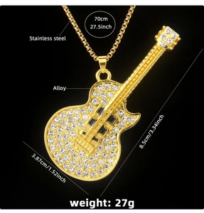 Detailed view of gold guitar necklace with crystal inlay showing precise dimensions and size